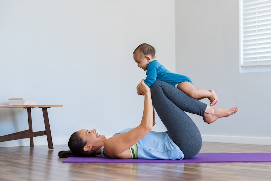 Mum exercising with baby | DNAfit Blo
