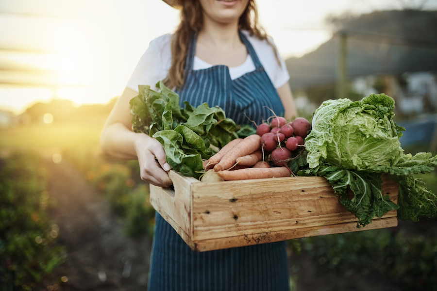 Woman in her garden, fresh veg | DNAfit Blog