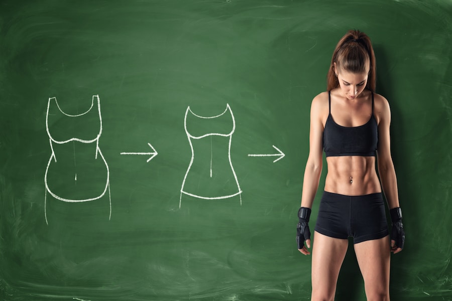 Woman standing in front of chalk board | DNAfit Blog