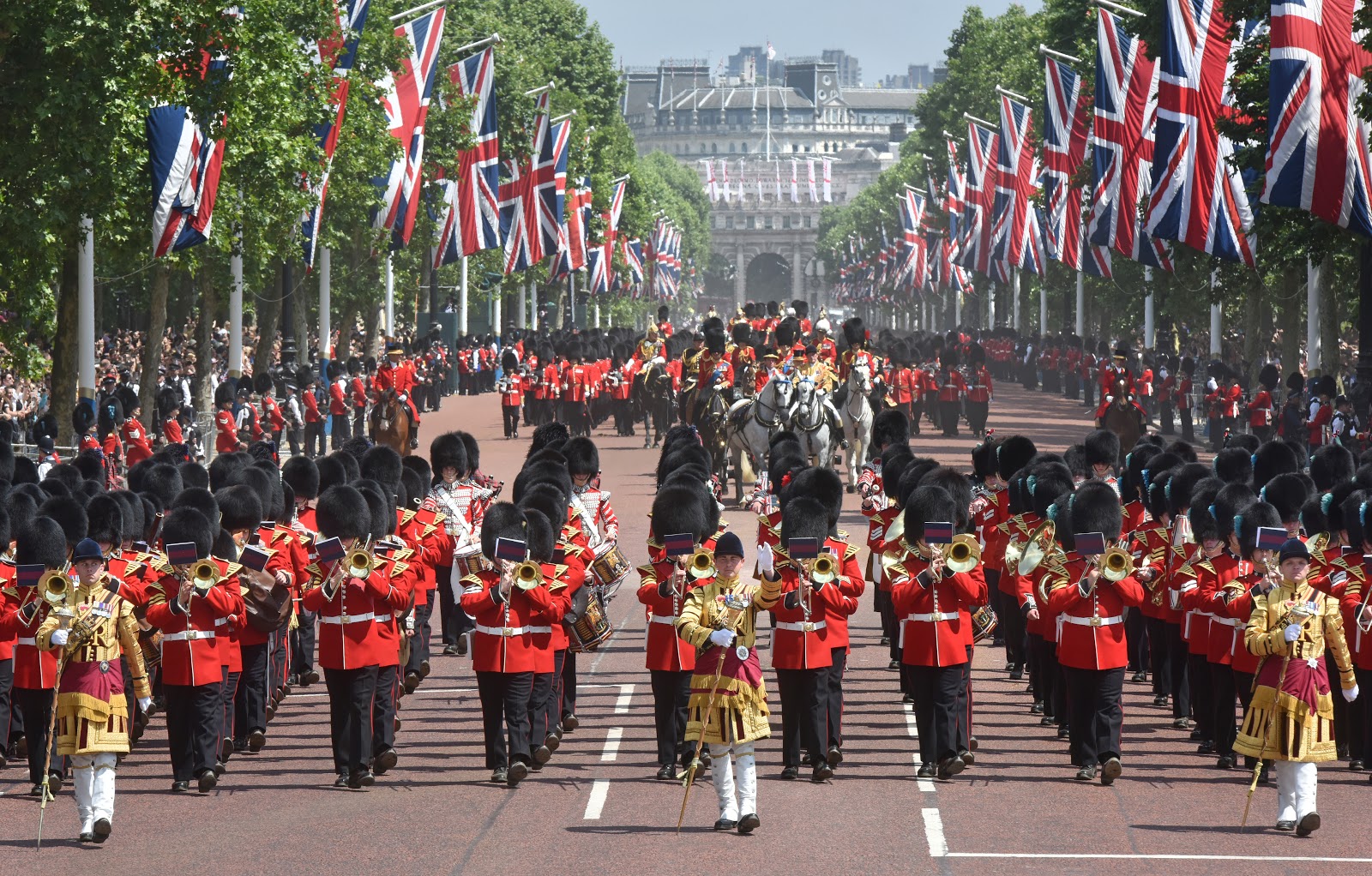 Guards and military bands march up the Mall in London in the Queen's annual birthday parade of Trooping the Colour